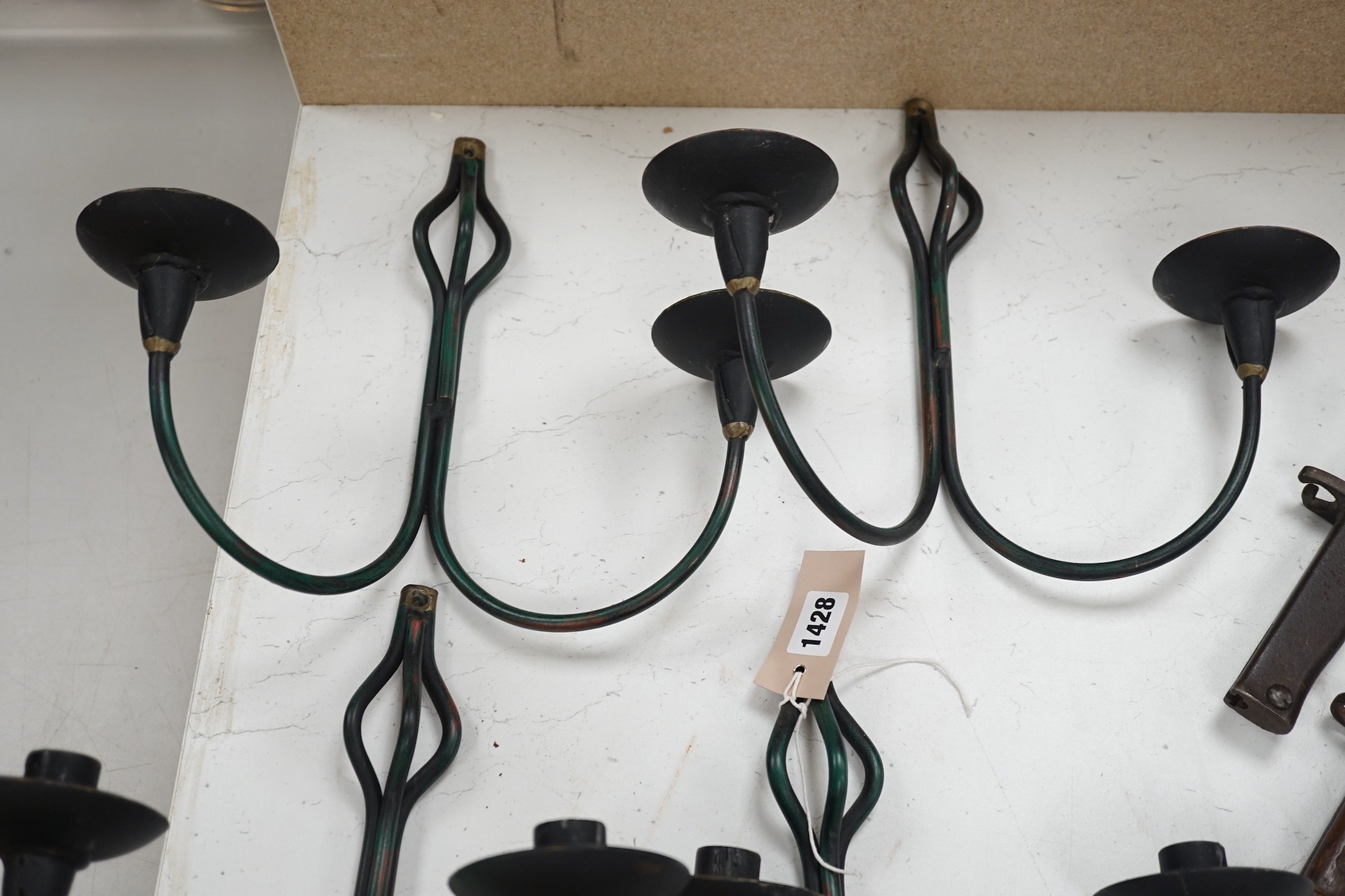 A set of four hand-forged twin-light wall sconces, 28cm long